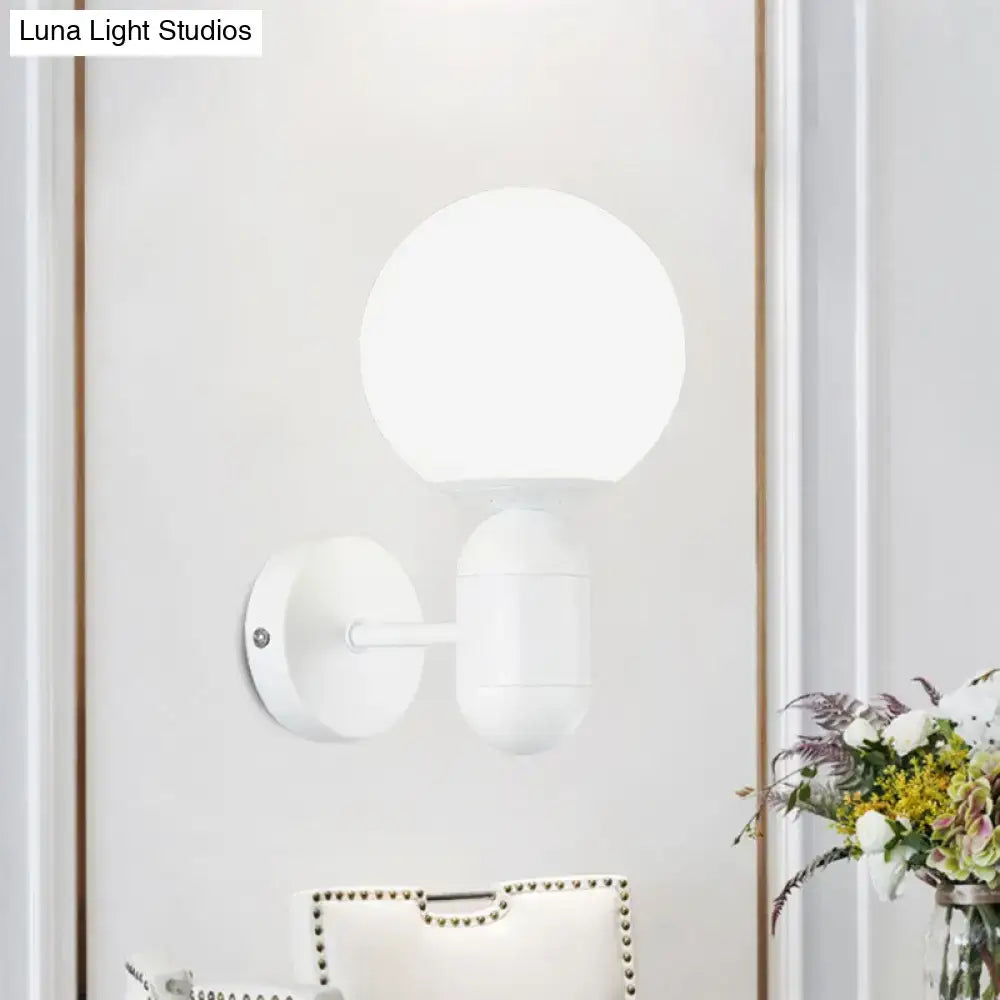 Modern black and white glass wall light featuring a white spherical globe minimalist wall lamp for meeting rooms