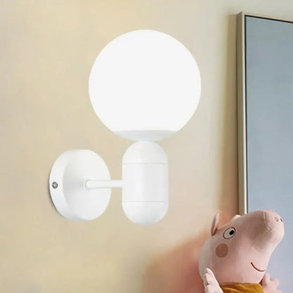 Modern black and white glass wall light featuring a white spherical matte glass wall lamp for meeting rooms