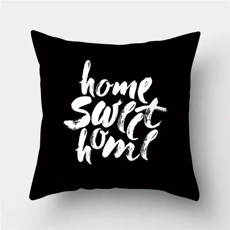 Black throw pillow with white brushstroke home sweet home text featuring decorbites geometric stripes pillowcase design