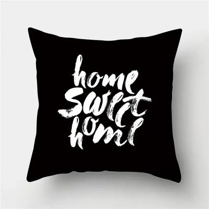 Black throw pillow with white brushstroke home sweet home text featuring decorbites geometric stripes pillowcase design