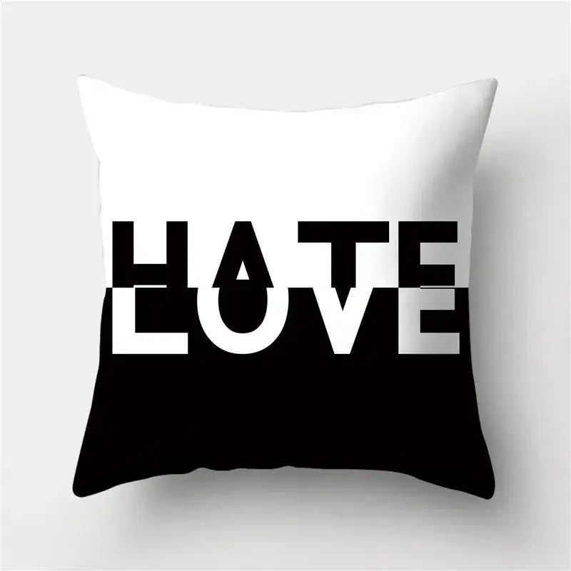 Modern black white and gold geometric stripes pillowcase with white and black throw pillow featuring hate love typography decorbites geometric stripes