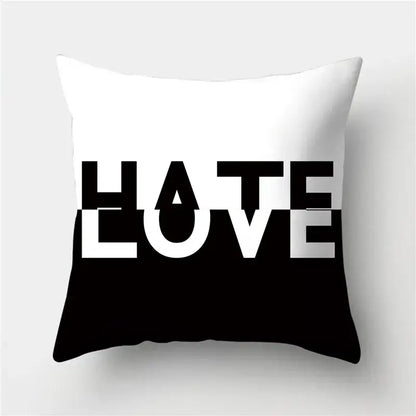 Modern black white and gold geometric stripes pillowcase with white and black throw pillow featuring hate love typography decorbites geometric stripes