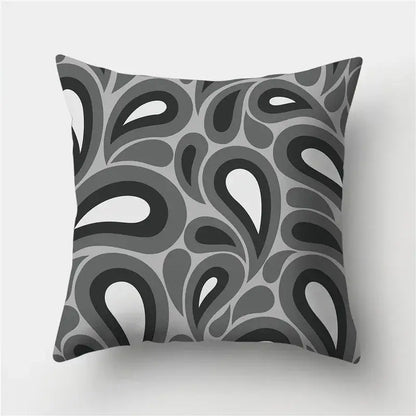A square throw pillow with a bold black gray white abstract paisley pattern for decorbites geometric stripes decor