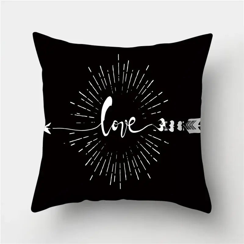Modern black white and gold geometric stripes pillowcase featuring a black throw pillow with white love design decorbites geometric stripes