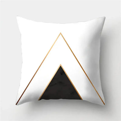 White throw pillow with modern geometric stripes pillowcase featuring gold-trimmed triangles and black marble center by decorbites