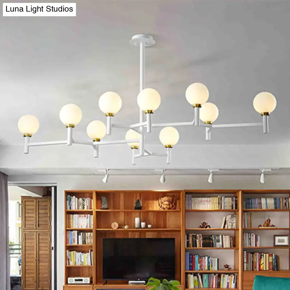 Decorbites modern orbit chandelier pendant with nine white gold frosted glass globes in black white gold finish