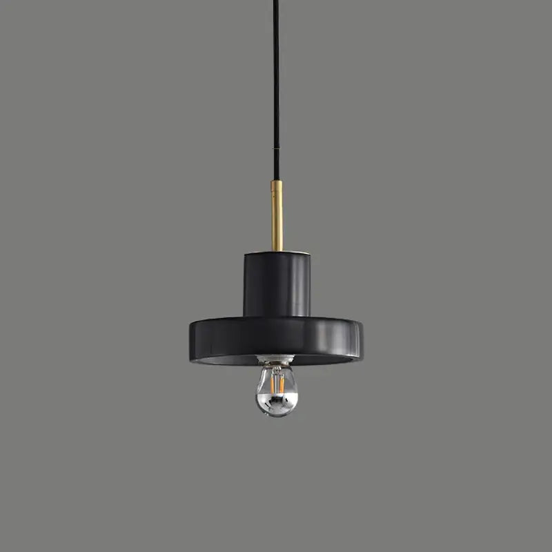 Modern black minimalist pendant light with matte finish and brass accent rod for decorbites green marble dining room
