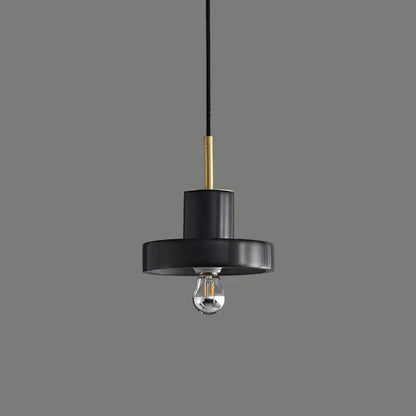 Modern black minimalist pendant light with matte finish and brass accent rod for decorbites green marble dining room