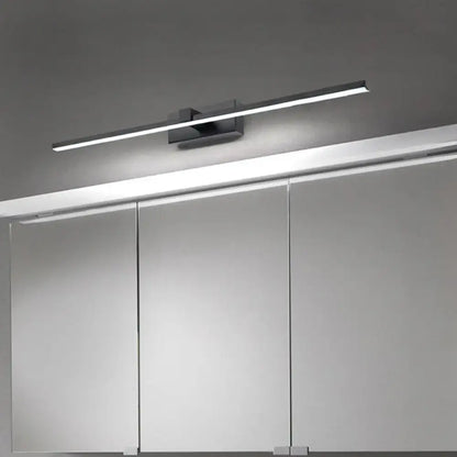 Modern black and white iron stick led mirror light bathroom lamp with chrome-finished bulb base mounted above cabinets