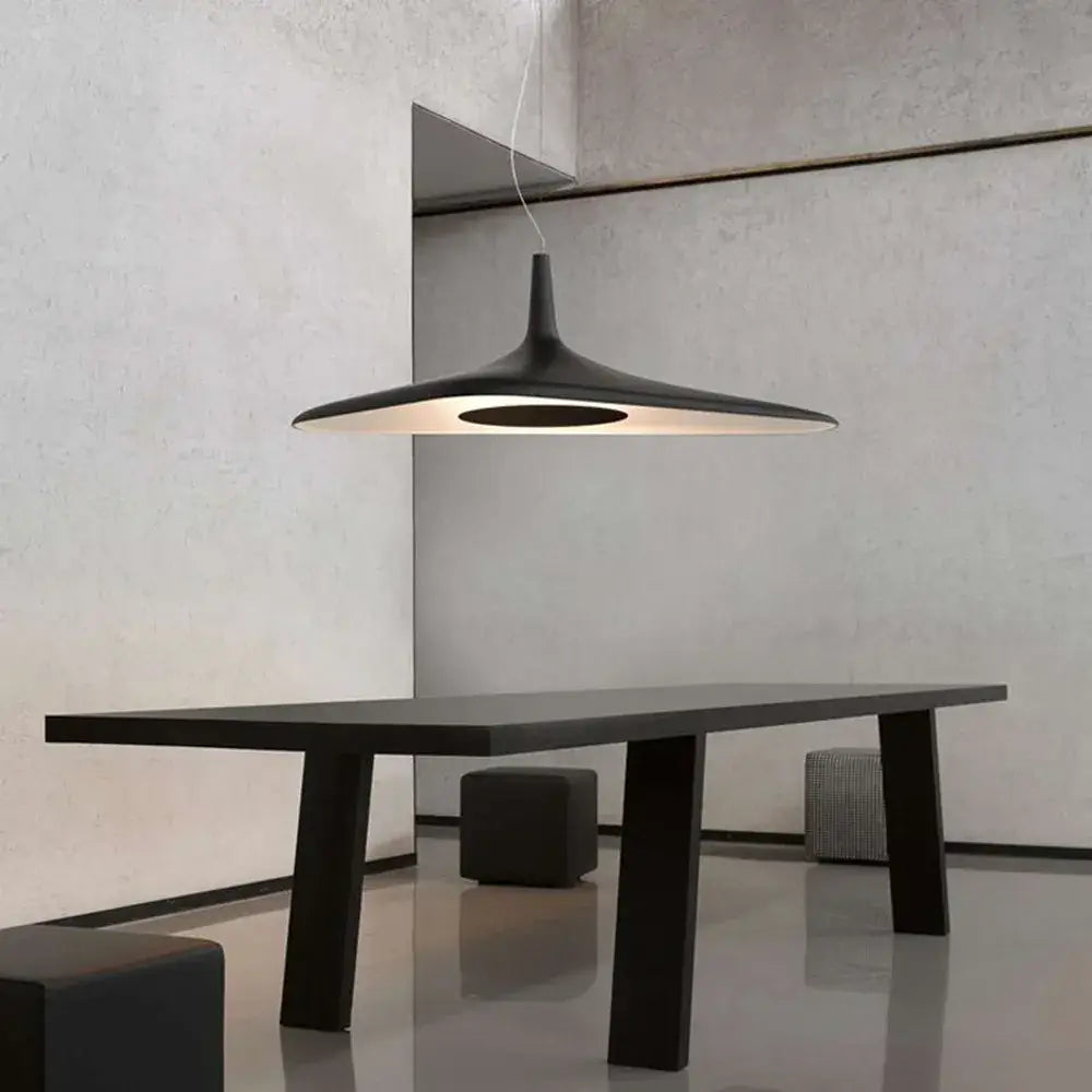 Modern black decorbites irregular pendant light with matte finish and warm interior glow for dining room decor