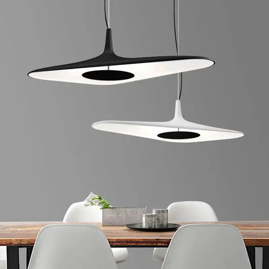 Modern black and white irregular resin pendant light with sleek disc shapes by decorbites for dining room decor