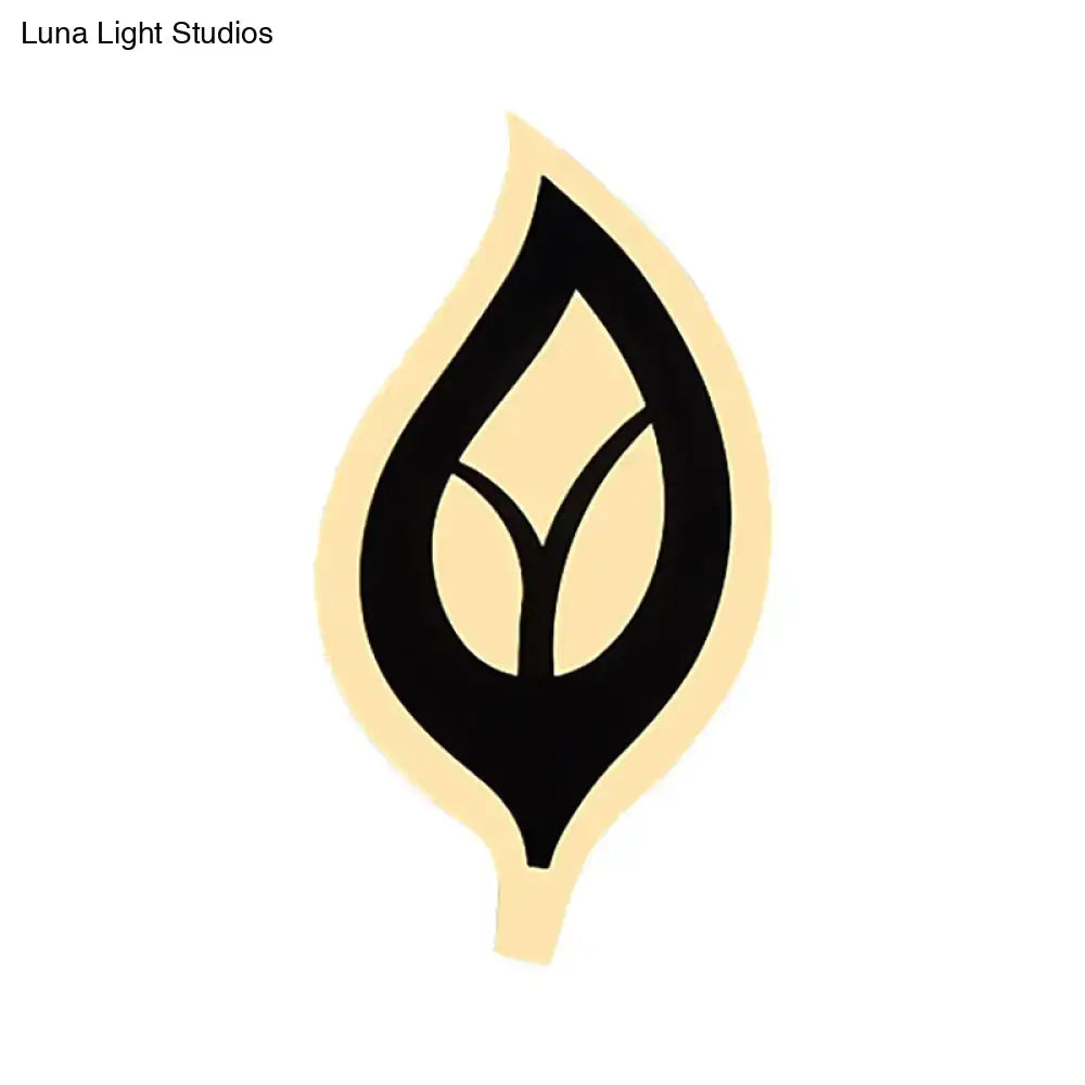 Modern black and white leaf sconce light with minimalist cream and black symmetrical leaf design for bedroom wall lamp