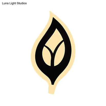 Modern black and white leaf sconce light with minimalist cream and black symmetrical leaf design for bedroom wall lamp