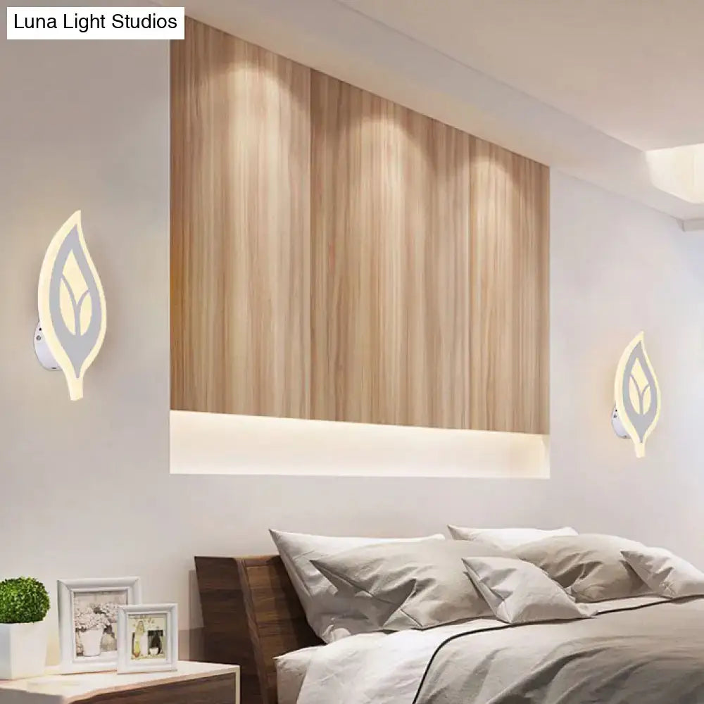 Modern black and white leaf sconce light with minimalist design and soft ambient lighting as a bedroom wall lamp