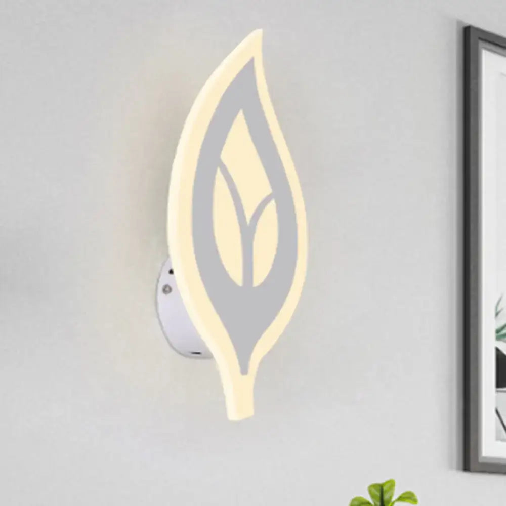 Modern black and white leaf sconce light with soft glowing wall lamp design in gray and cream for bedroom use