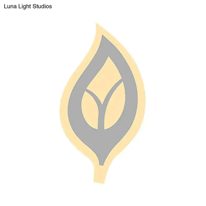 Modern black and white leaf sconce light wall lamp with a stylized soft yellow and gray leaf logo and central vein design