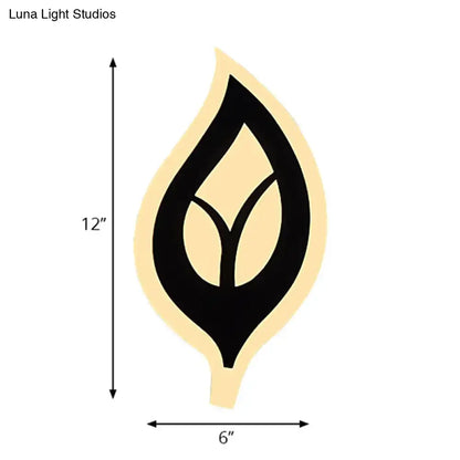 A modern black and cream leaf-shaped sconce light wall lamp measuring 12 by 6 inches for bedroom use