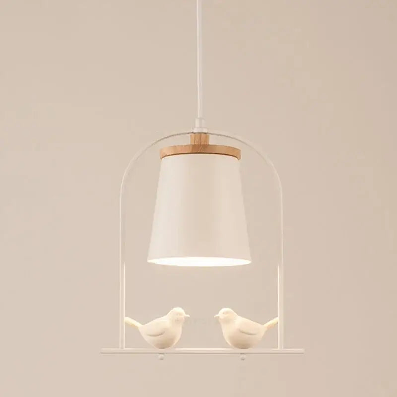 Modern black and white led bird wall sconce featuring a white ceramic bird pendant with minimalist metal frame and wooden accent decorbites led bird