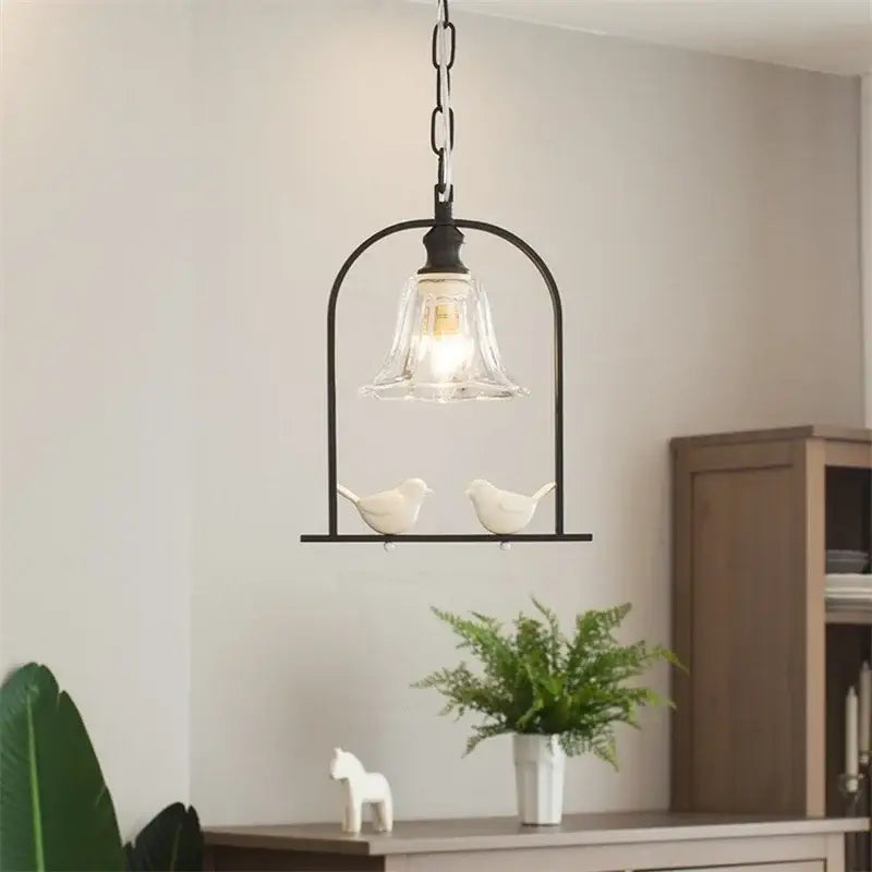 Modern black metal birdcage pendant light with clear glass shade and white ceramic birds for decorbites led bird wall use