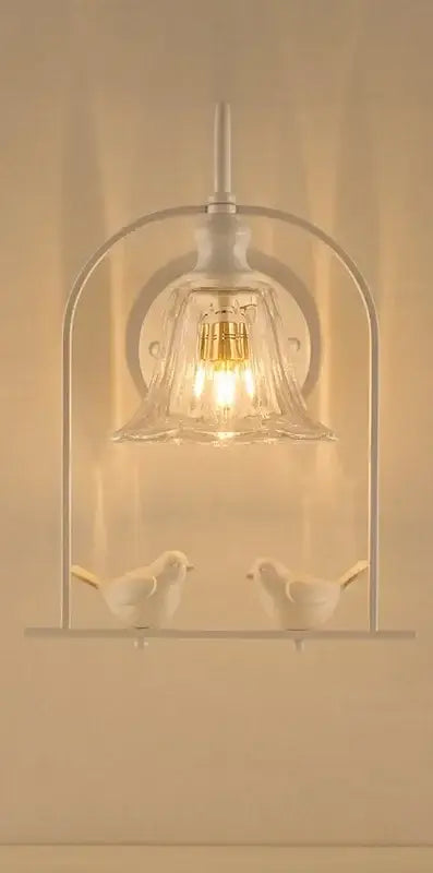 Modern black and white led bird wall sconce with white metal and glass featuring two decorative birds by decorbites led bird