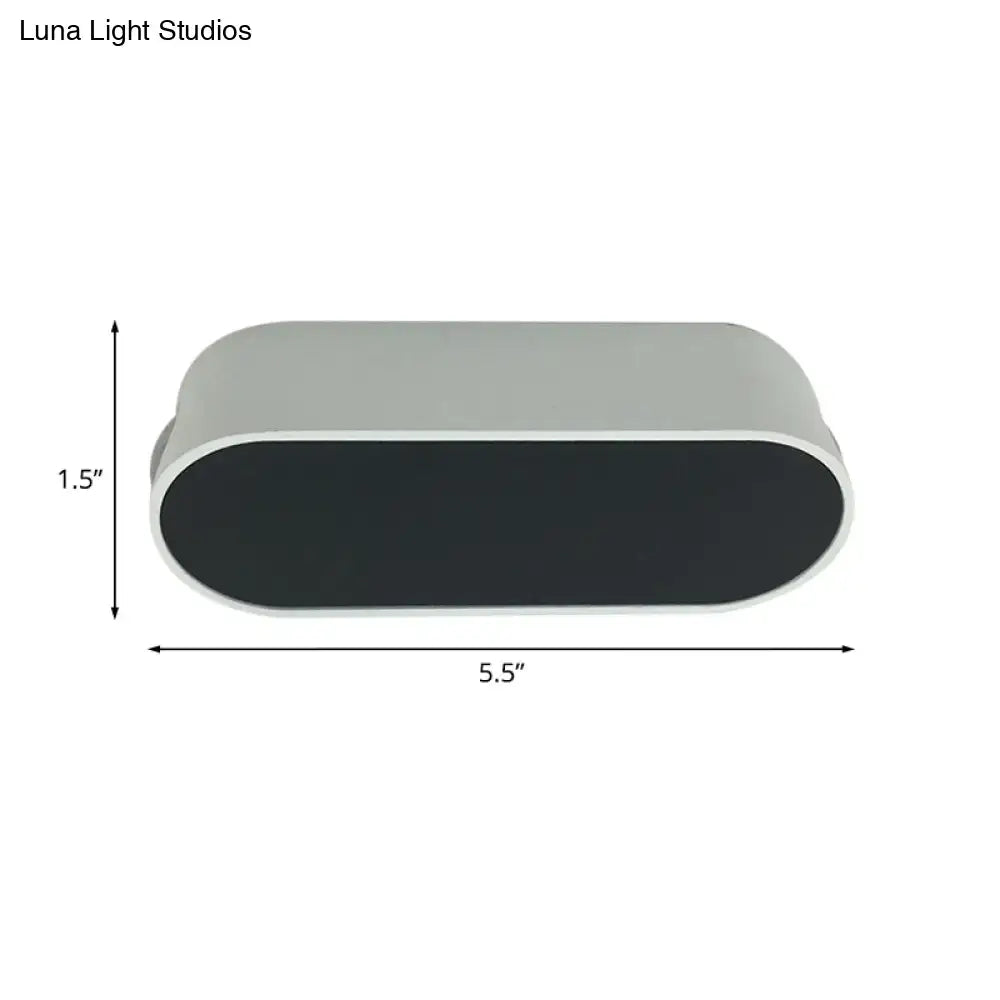 Modern oval-shaped led flush wall lamp with metal shade in matte gray and black by Luna Light Studios for bedroom use