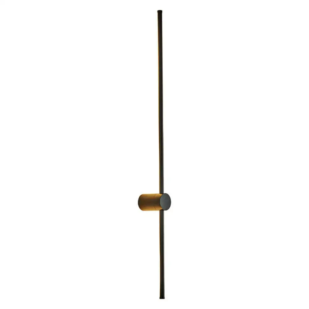 Minimalist black and gold led metal wall sconce with cylindrical accent for modern indoor lighting in living room