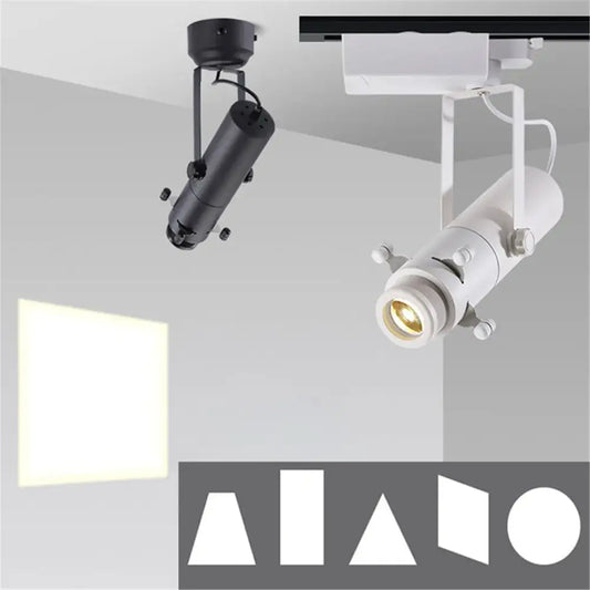Modern black and white led track light with adjustable cylindrical bodies and articulated arms for gallery spotlight use