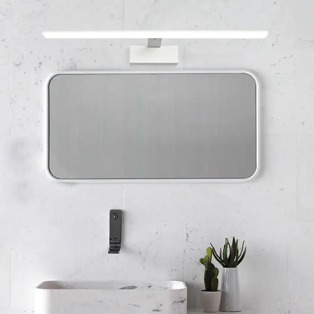White rectangular bathroom mirror with a sleek minimalist frame paired with modern black white vanity lamp light