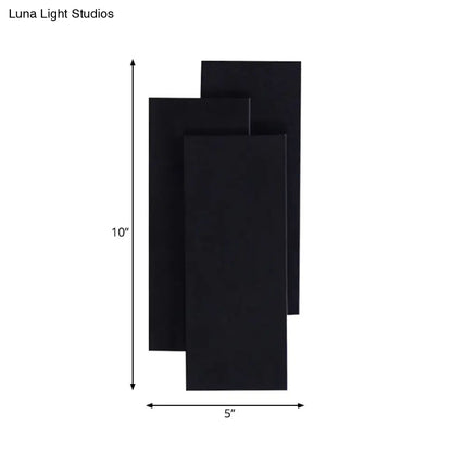 Modern black and white wall lamp with layered rectangular panels and 5in fixture height for bedroom use