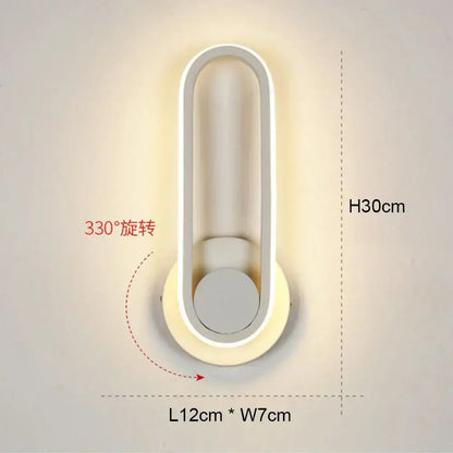 Modern black and white led wall light with sleek oval shape and 330-degree adjustable rotation for bedroom use