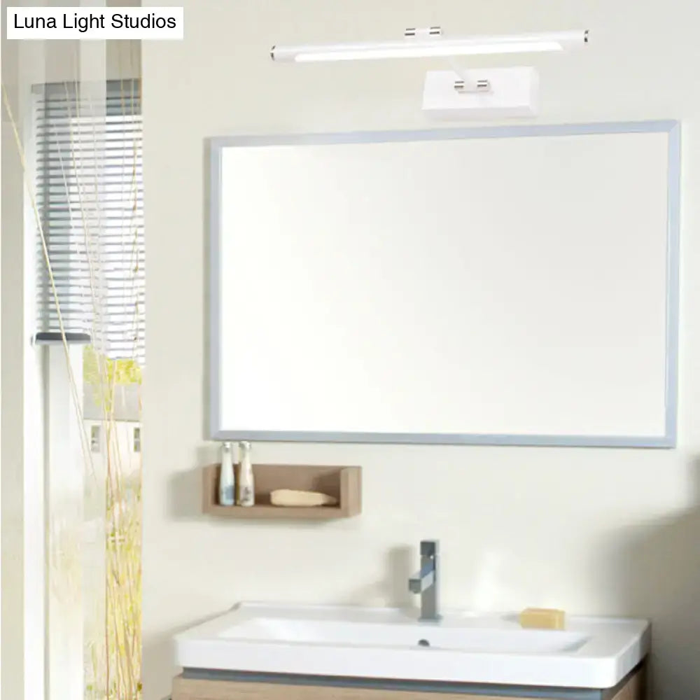 White rectangular bathroom mirror with slim silver frame paired with modern black and white led wall sconce 18 inch fixture