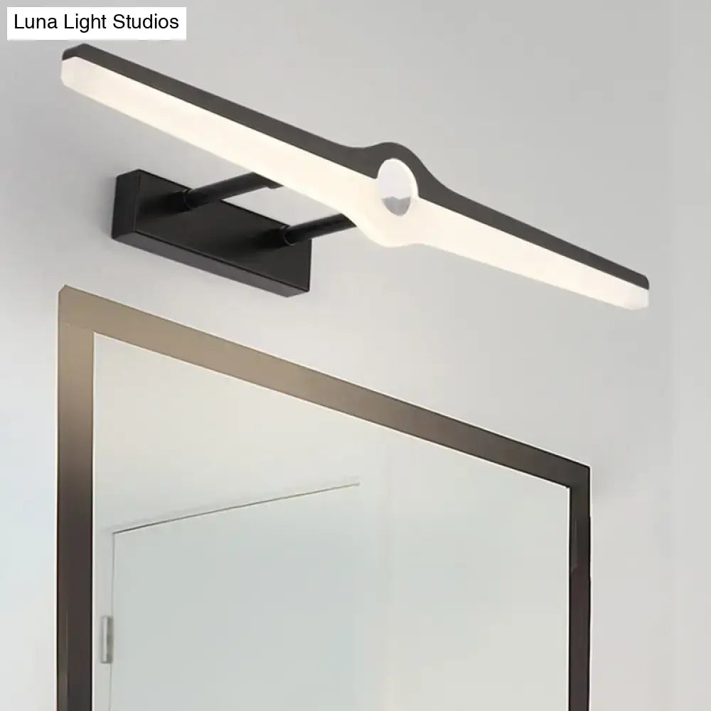 Modern black and white led wall sconce with sleek elongated design and central circular accent for minimalist living room lighting