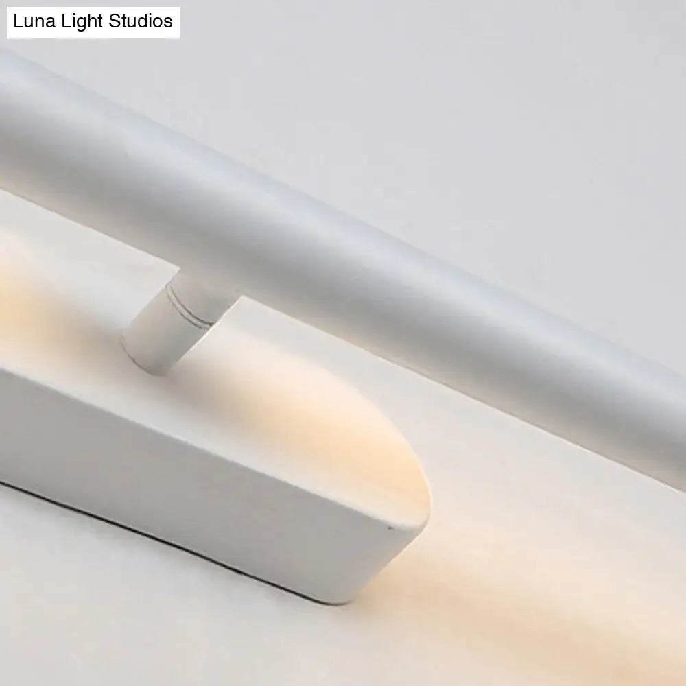 White minimalist modern led wall sconce with sleek cylindrical arm and matte-finished base for bathroom vanity light