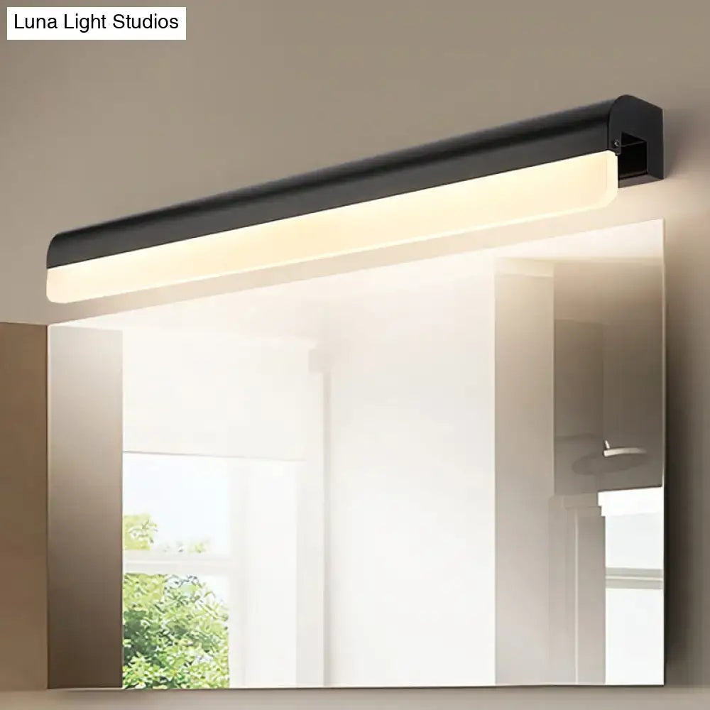 Modern black and white linear led wall light with sleek rectangular design mounted above a bathroom vanity mirror
