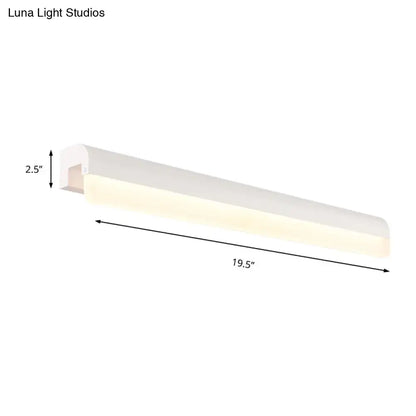 Modern black and white linear led wall light with sleek rectangular design and warm glow for bathroom sconce