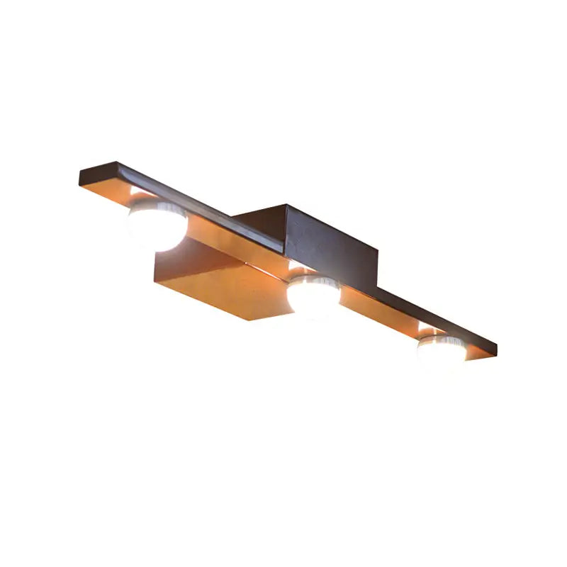 Modern black white wall lighting with geometric ceiling fixture in black and copper finish featuring warm white light bulbs