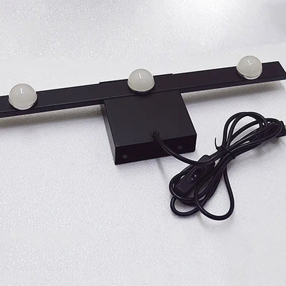 Modern black and white linear wall lighting with three frosted globe bulbs and a coiled power cord for warm white light