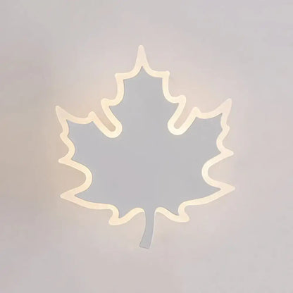 Modern black and white maple leaf sconce light with warm white led glow for minimalist bedroom wall decor