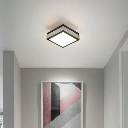 Modern black and white mesh led ceiling light square fixture with black metal frame emitting bright white illumination