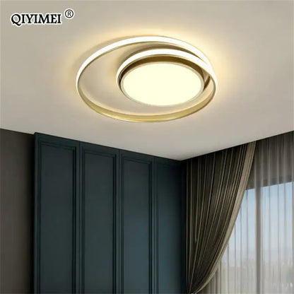 Modern black and white minimalist led ceiling light with sleek gold and white rings emitting warm ambient decorbites led ceiling illumination