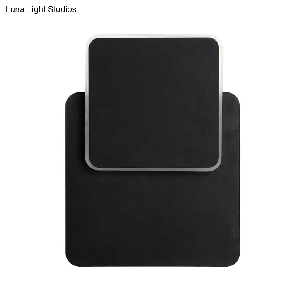 Modern black rectangular wall lamp with a sleek silver frame featuring led light for minimalist bedroom sconce lighting