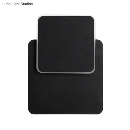 Modern black rectangular wall lamp with a sleek silver frame featuring led light for minimalist bedroom sconce lighting