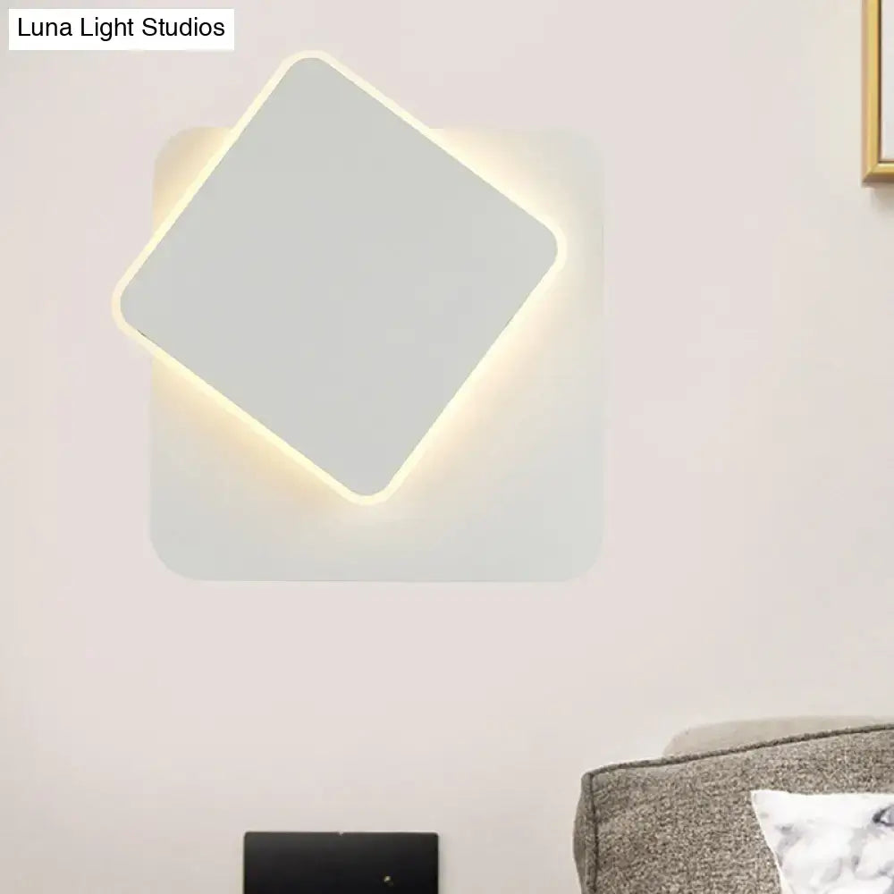 Modern black and white minimalist wall lamp with sleek white finish and softly glowing led light edge for bedroom use