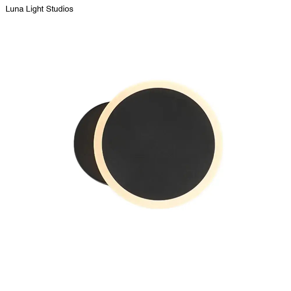 Modern black and white minimalist led wall sconce with a sleek black matte finish and warm beige led ring for living room lighting