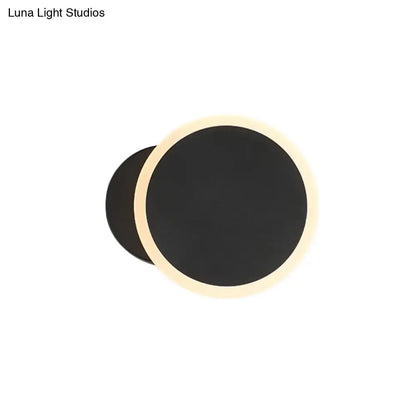 Modern black and white minimalist led wall sconce with a sleek black matte finish and warm beige led ring for living room lighting