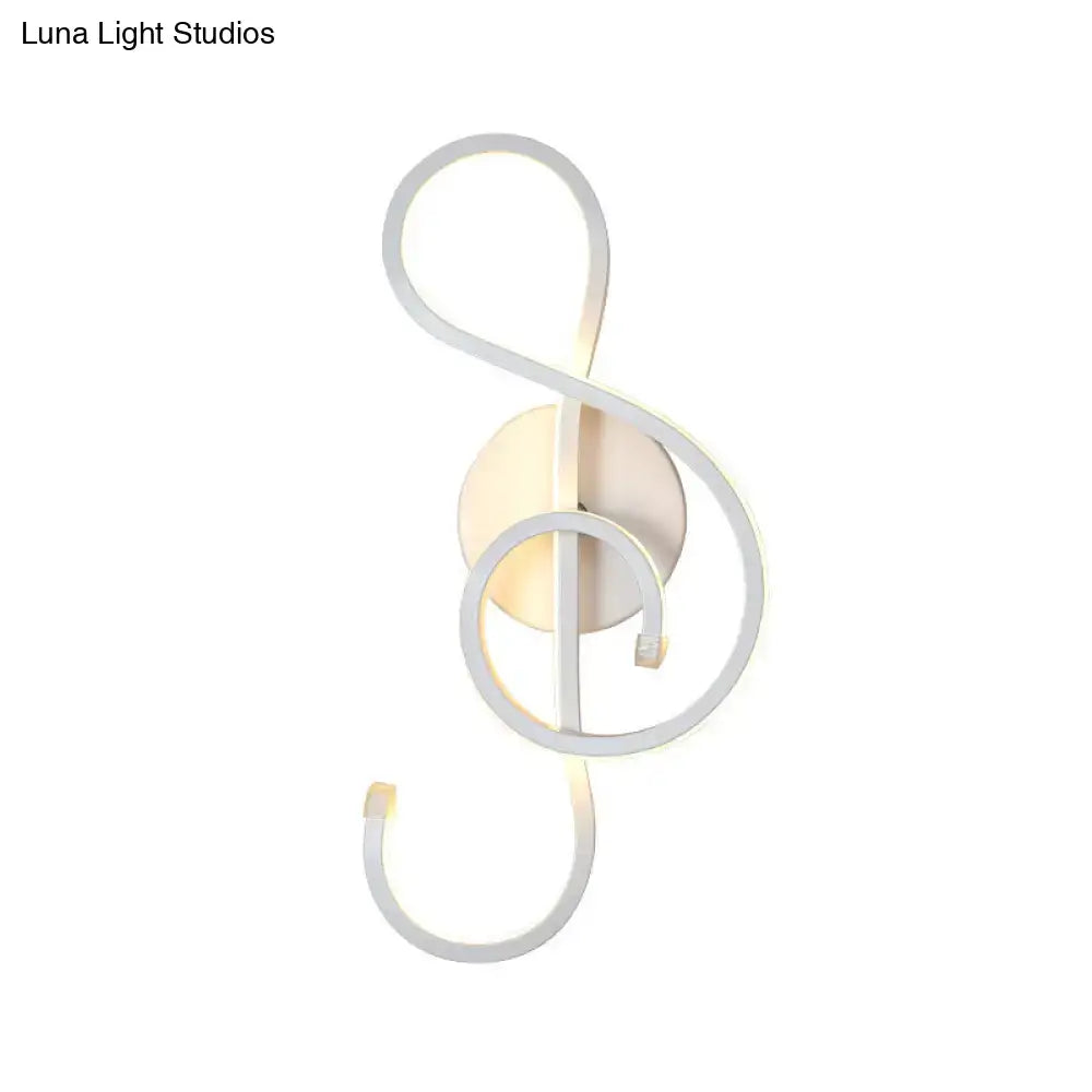 Modern black and white wall lamp shaped like a musical note with an acrylic shade for bedroom use