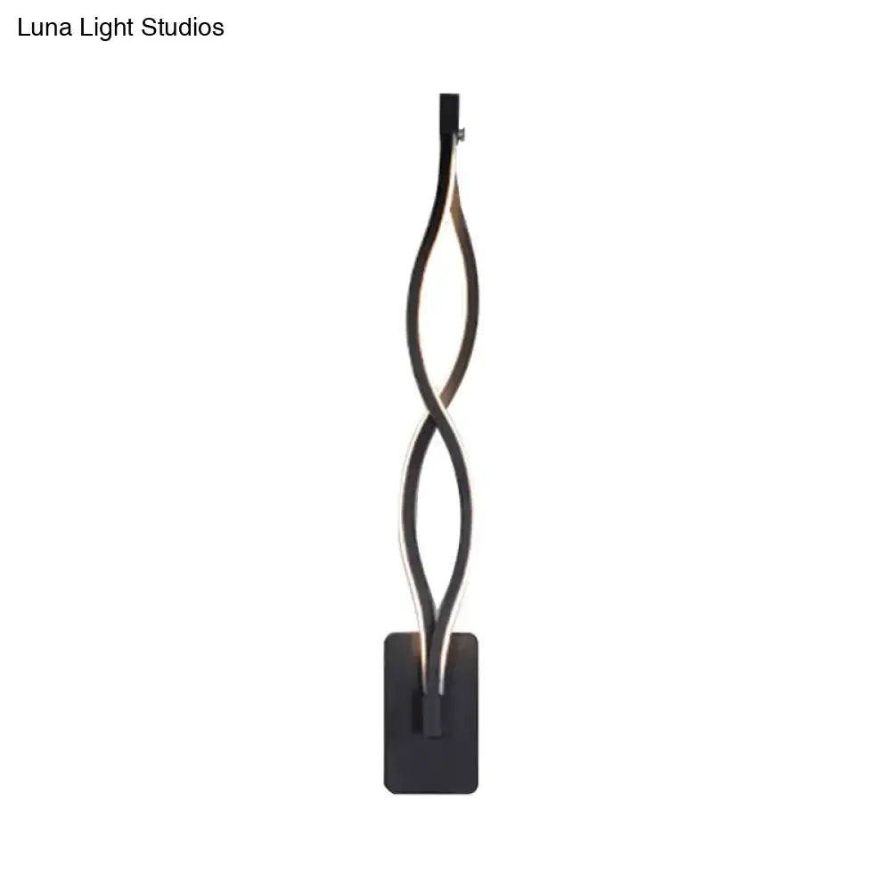 Modern black twisted led floor lamp with illuminated central strip paired with musical note acrylic shade wall lamp