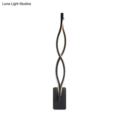 Modern black twisted led floor lamp with illuminated central strip paired with musical note acrylic shade wall lamp