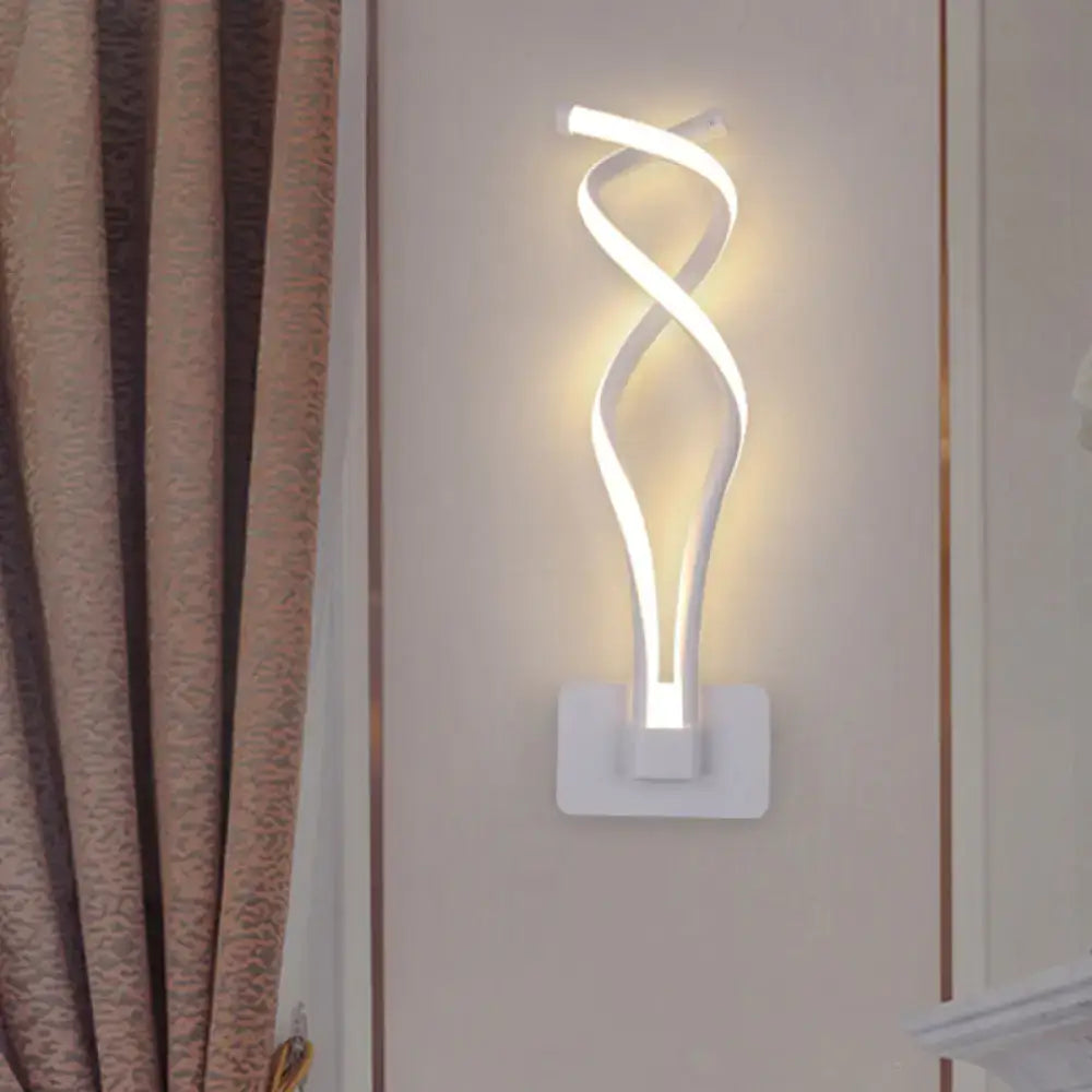 White led wall lamp with a sleek twisted design and acrylic shade in modern black and white musical note style