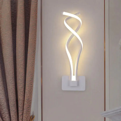 White led wall lamp with a sleek twisted design and acrylic shade in modern black and white musical note style